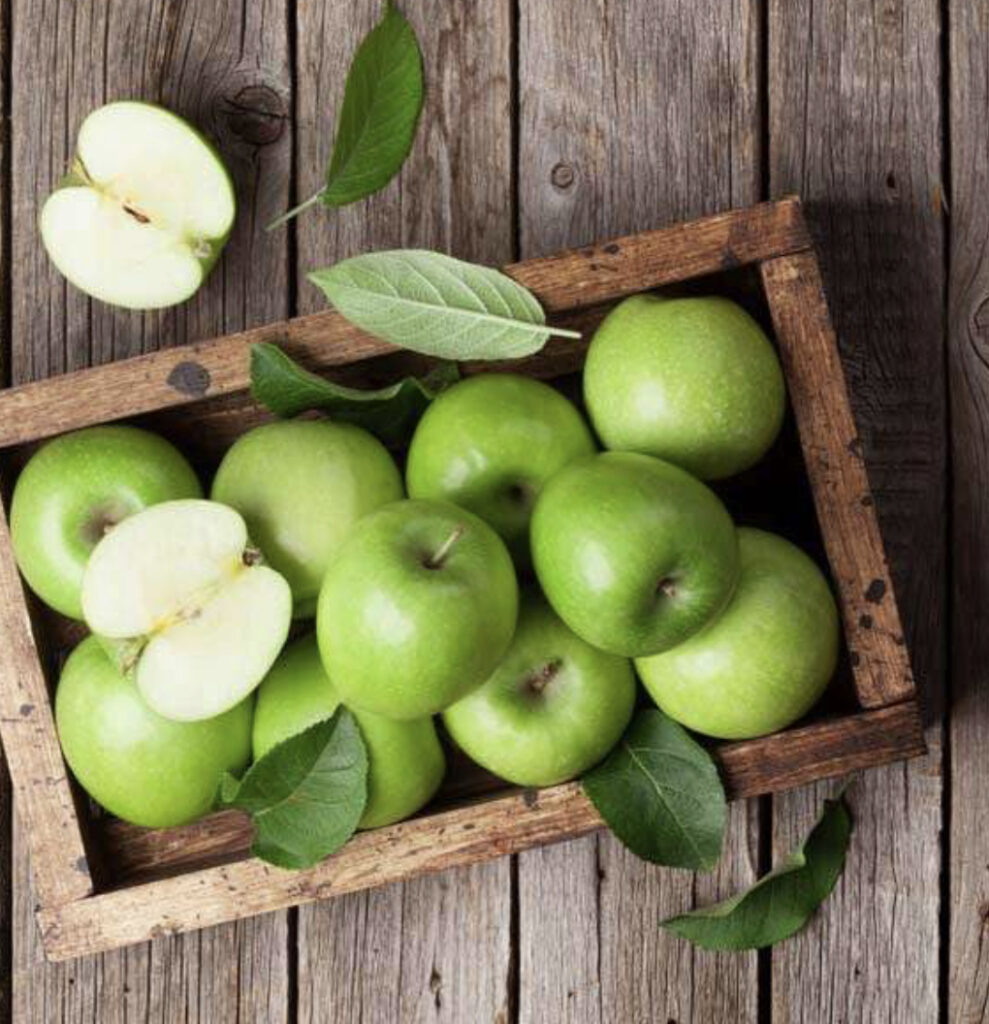 Green apples in box